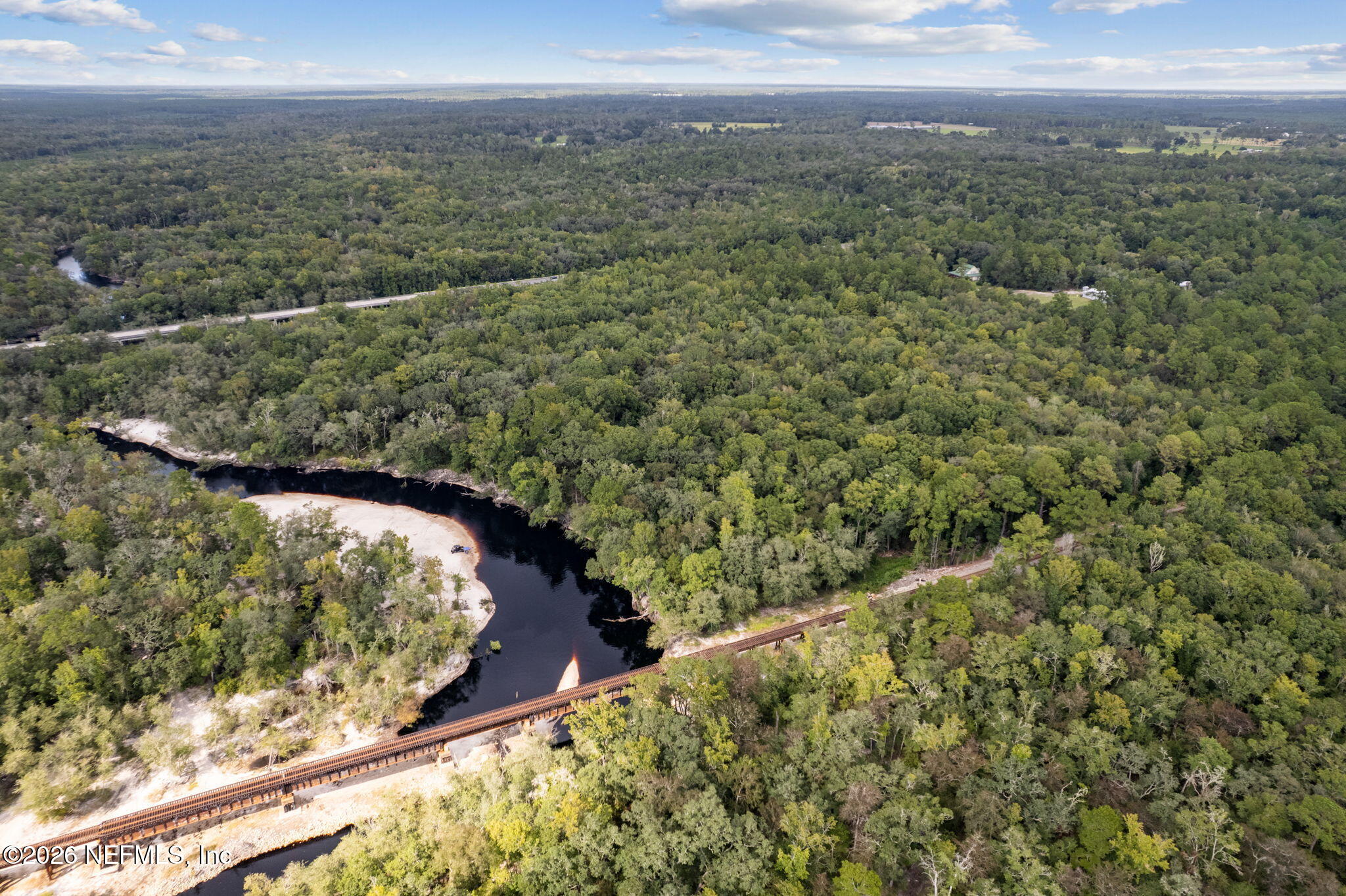 0 Tom Crawford Road Hilliard, FL 32046 - Photo 3 of 5 a view of a yard and mountain from a yard