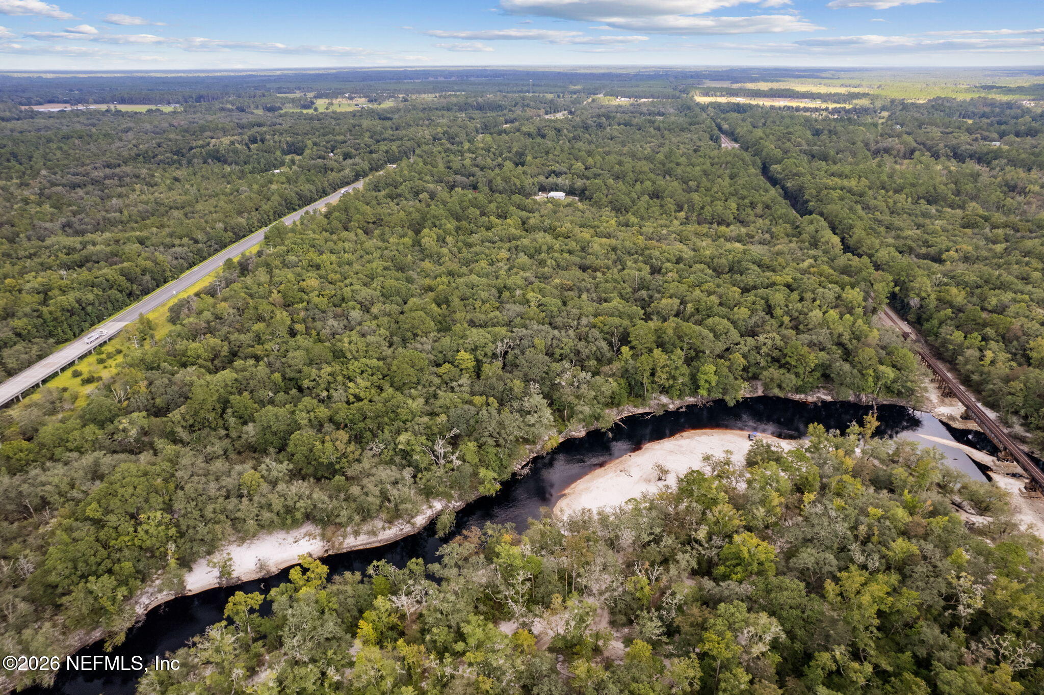 0 Tom Crawford Road Hilliard, FL 32046 - Photo 4 of 5 a view of a lake with a mountain in the background