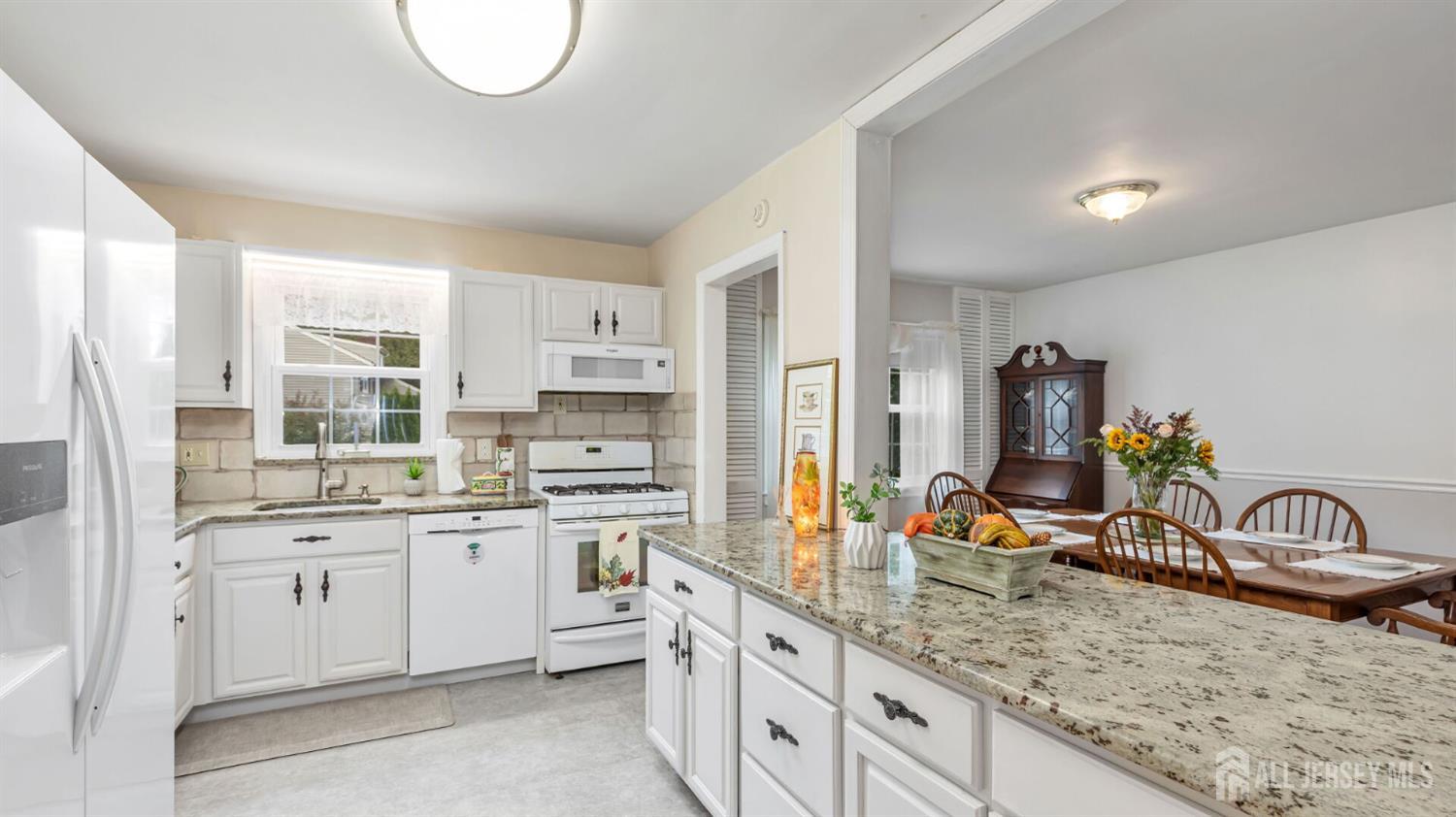 77-89 Parkside Road Plainfield, NJ 07060 - Photo 13 of 42 a kitchen with a sink stove and cabinets