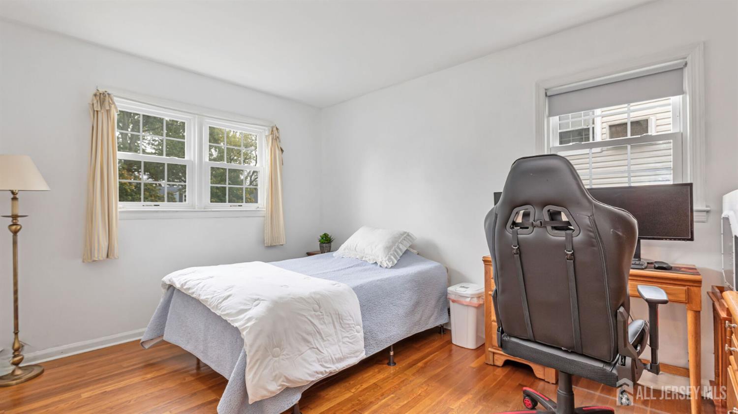 77-89 Parkside Road Plainfield, NJ 07060 - Photo 16 of 42 a bedroom with a bed and wooden floor