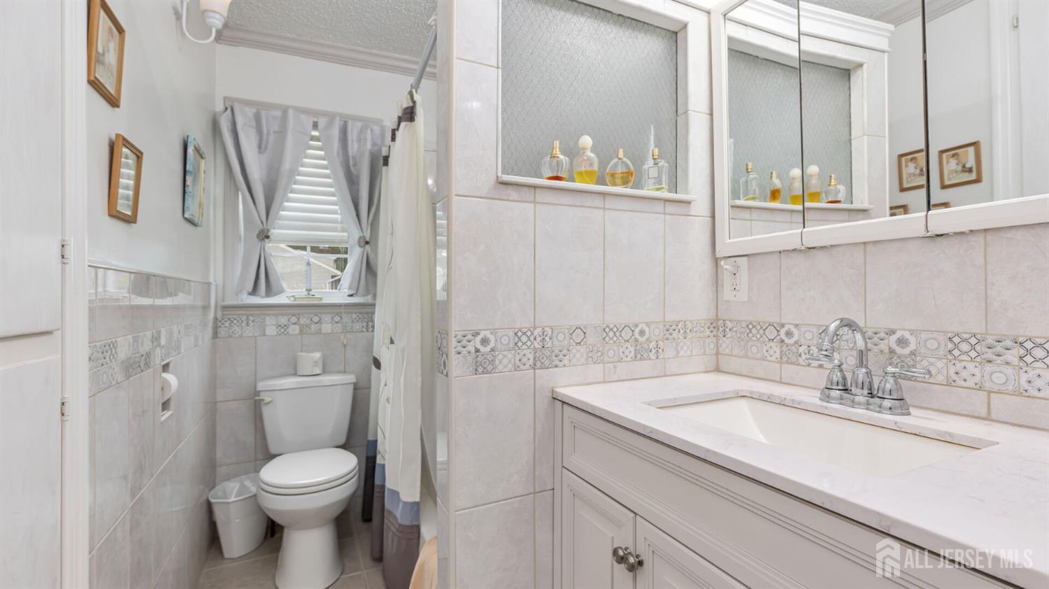 77-89 Parkside Road Plainfield, NJ 07060 - Photo 21 of 42 a bathroom with a sink a toilet and shower