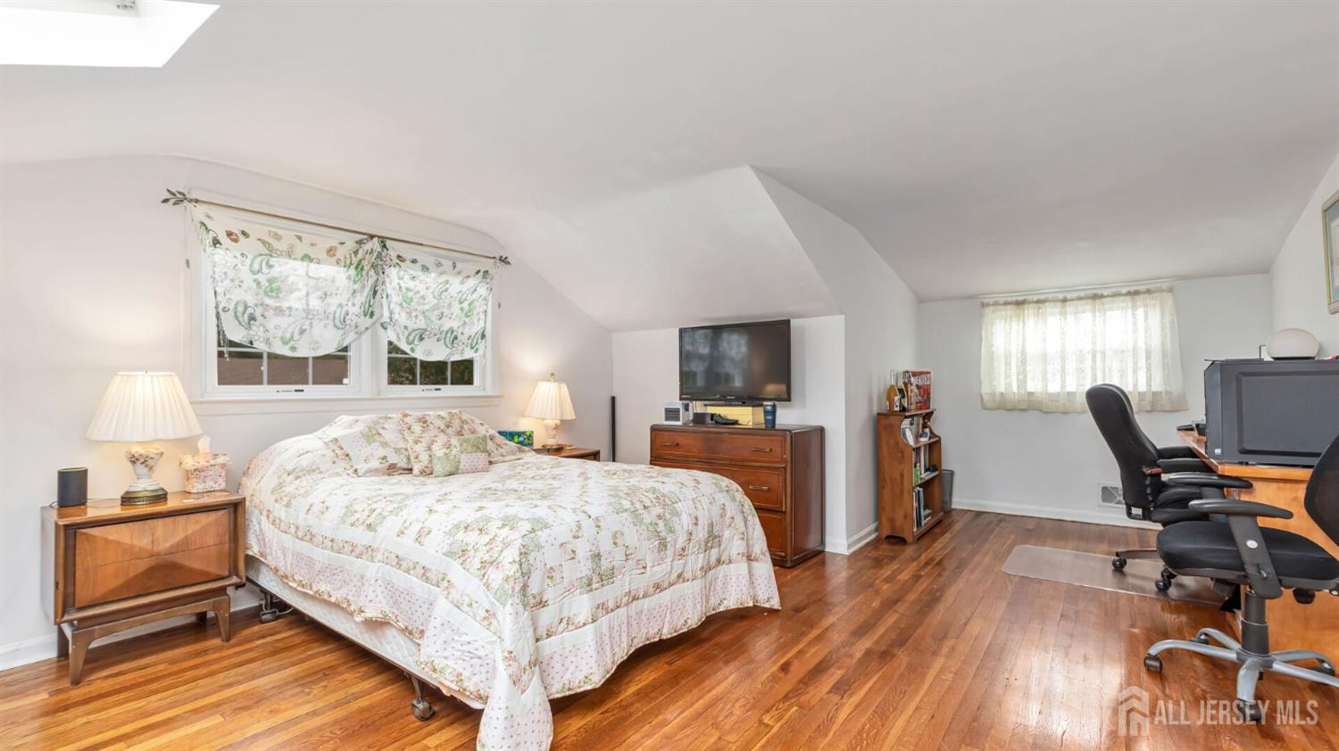 77-89 Parkside Road Plainfield, NJ 07060 - Photo 22 of 42 a bedroom with a bed a chair and a large window