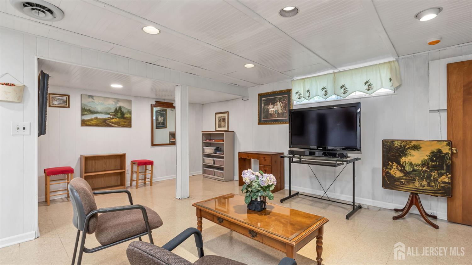 77-89 Parkside Road Plainfield, NJ 07060 - Photo 28 of 42 a living room with furniture and a flat screen tv