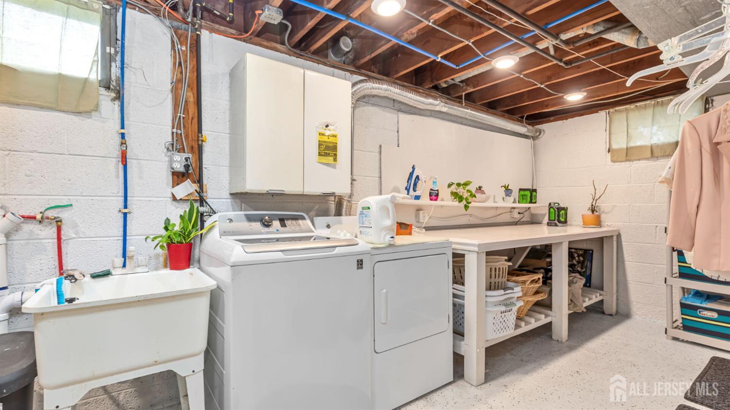 77-89 Parkside Road Plainfield, NJ 07060 - Photo 30 of 42 a view of a storage & utility room with washer and dryer