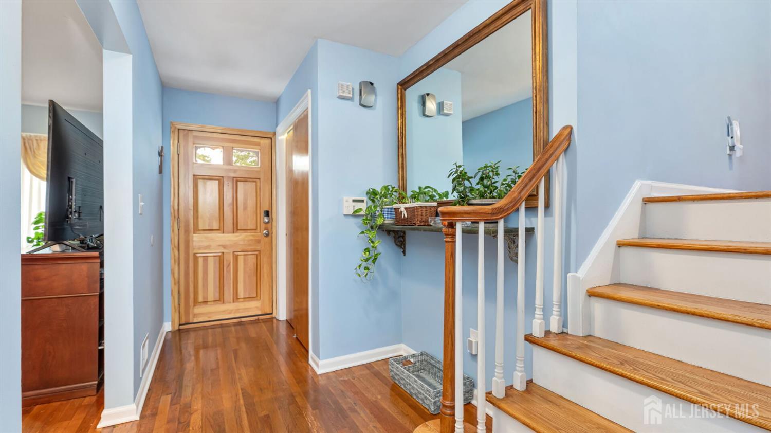 77-89 Parkside Road Plainfield, NJ 07060 - Photo 3 of 42 a view of a hallway with wooden floor and entryway