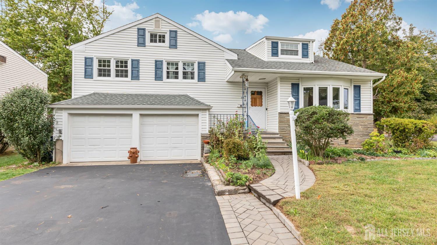 77-89 Parkside Road Plainfield, NJ 07060 - Photo 34 of 42 a front view of a house with a garden