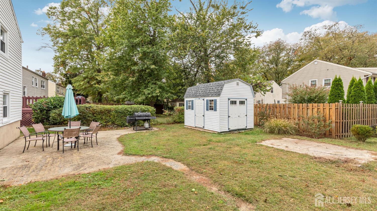 77-89 Parkside Road Plainfield, NJ 07060 - Photo 39 of 42 a white house that has a tree in front of it