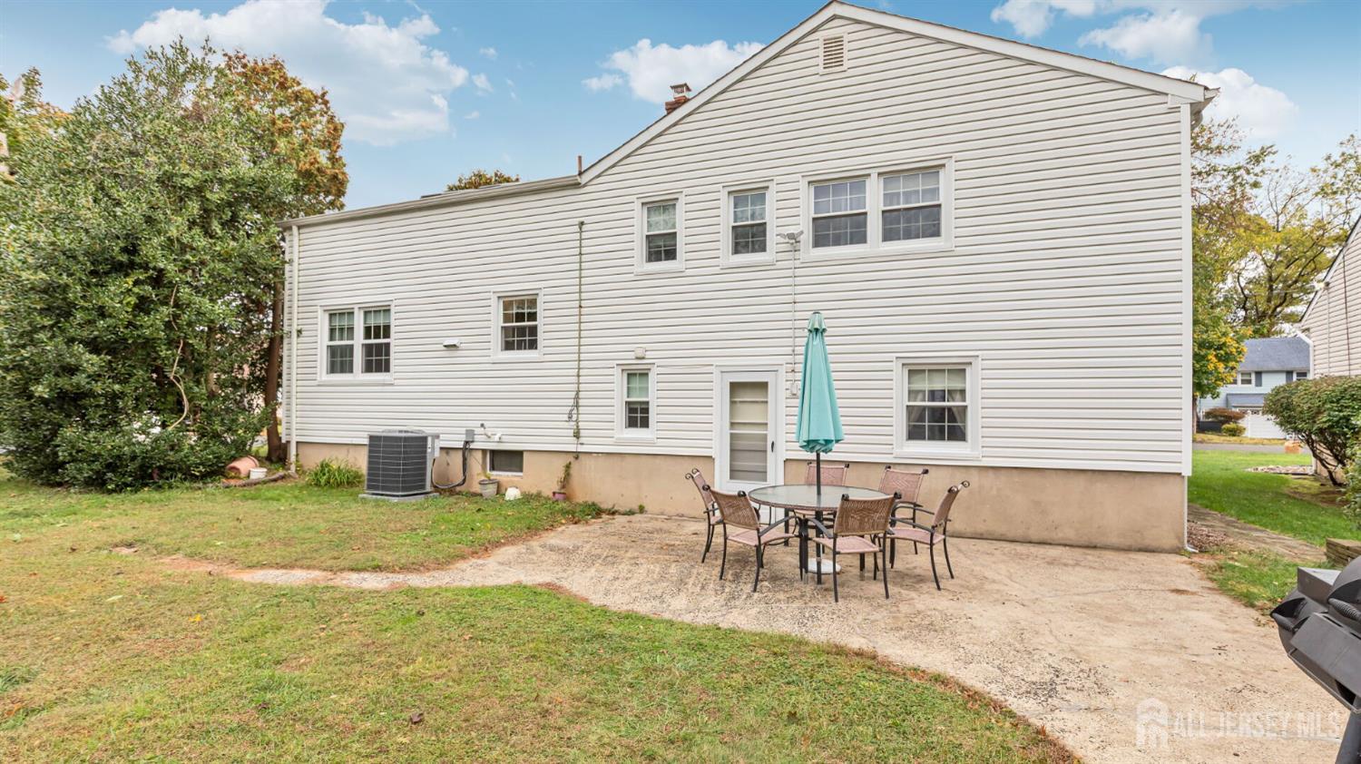 77-89 Parkside Road Plainfield, NJ 07060 - Photo 41 of 42 a view of a house with patio and a garden