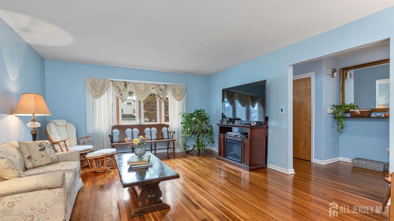 77-89 Parkside Road Plainfield, NJ 07060 - Photo 5 of 42 a living room with furniture and a wooden floor