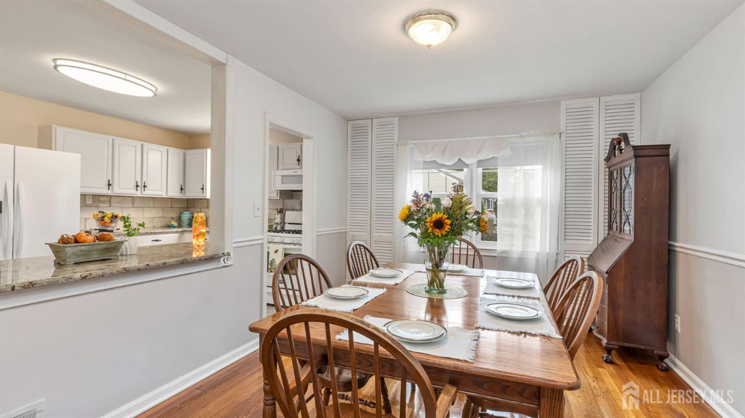 77-89 Parkside Road Plainfield, NJ 07060 - Photo 8 of 42 a view of a dining room with furniture and a chandelier