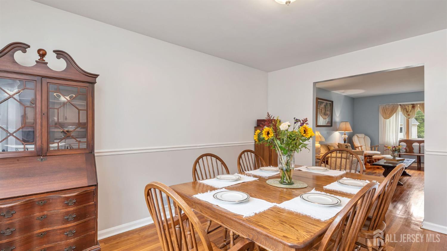 77-89 Parkside Road Plainfield, NJ 07060 - Photo 9 of 42 a dining room with furniture potted plants and wooden floor