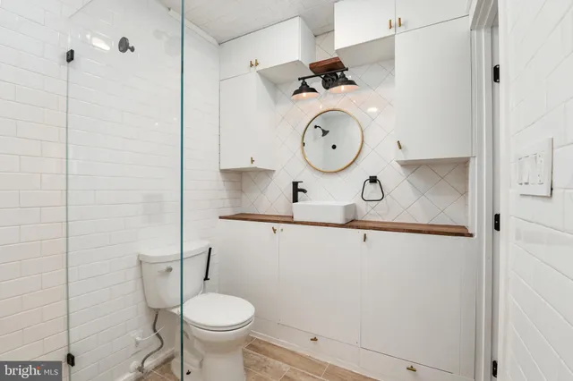 a bathroom with a toilet and a sink