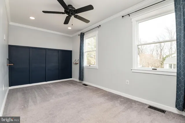 an empty room with closet area