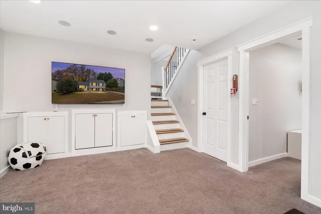 a bedroom with a bed and a ceiling fan