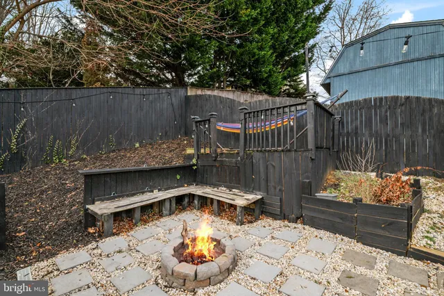 a view of a house with wooden fence