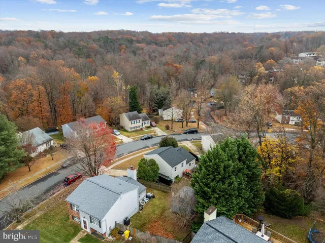 an aerial view of a house with a yard patio swimming pool and outdoor seating