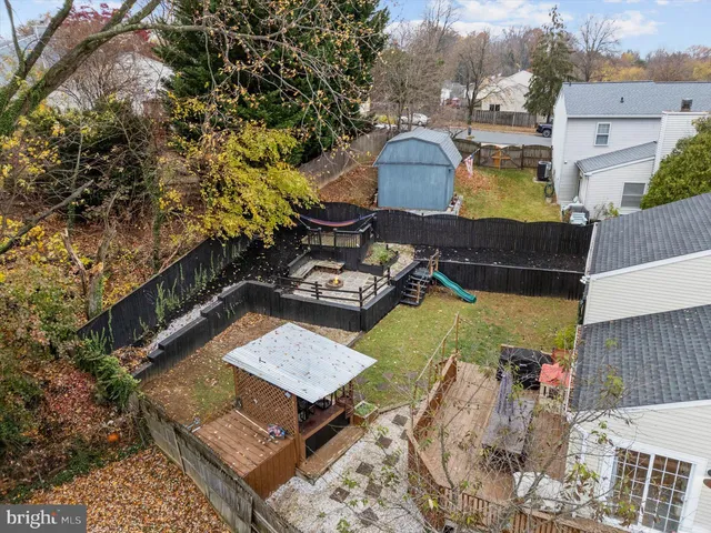 an aerial view of a house with a big yard