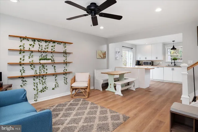 a living room with furniture and white walls