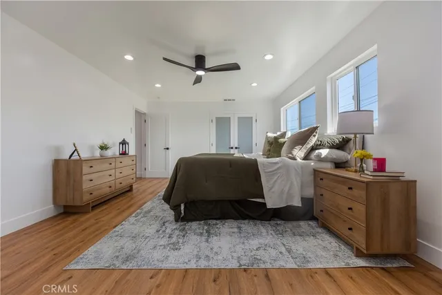 a view of a room with wooden floor and shelf