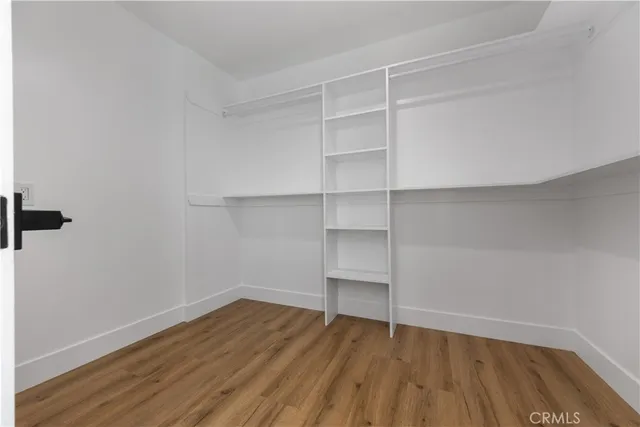 a spacious bathroom with a tub sink and mirror