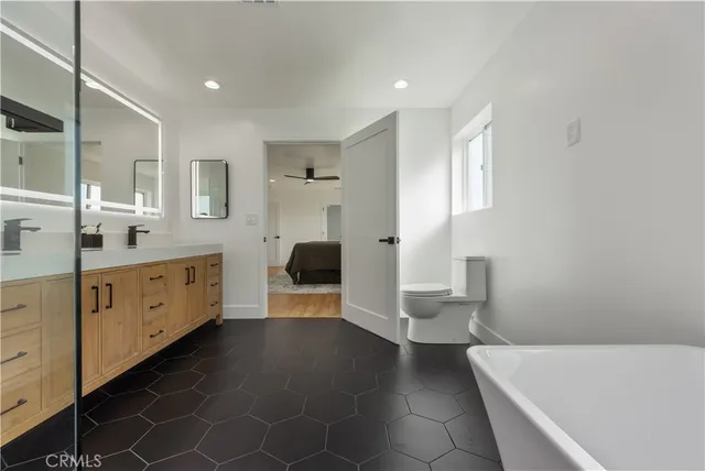 a bathroom with a double vanity sink mirror and double