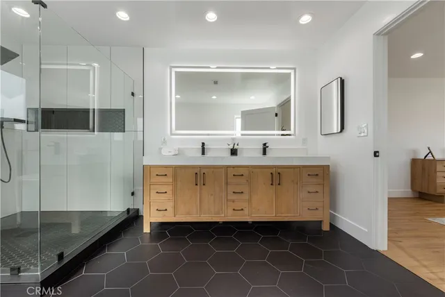 a bedroom with a bed and a ceiling fan