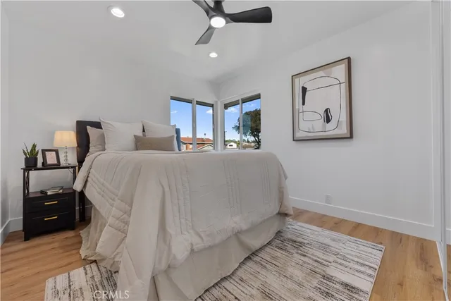 a spacious bedroom with a bed and a window