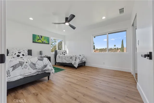 a bathroom with a bathtub sink and mirror