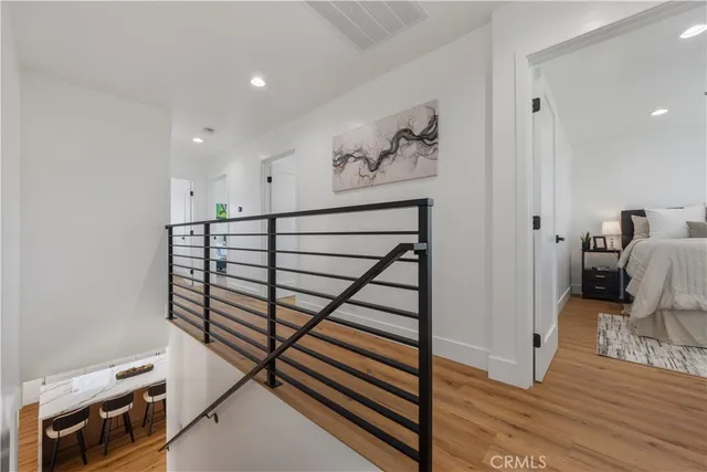 a bathroom with a granite countertop sink mirror vanity and toilet