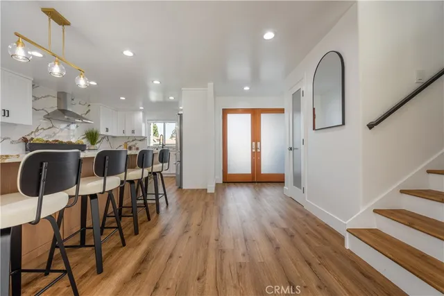 a large kitchen with a table and chairs