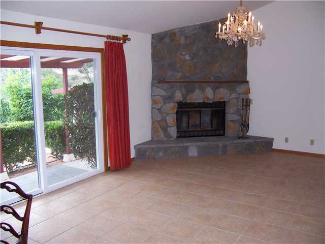 4005 South Mission Road Fallbrook, CA 92028 - Photo 6 of 23 The view and stone fireplace in living room