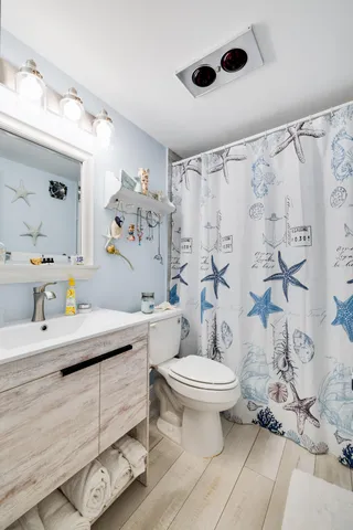 a view of outdoor space deck and mountain view in front of house
