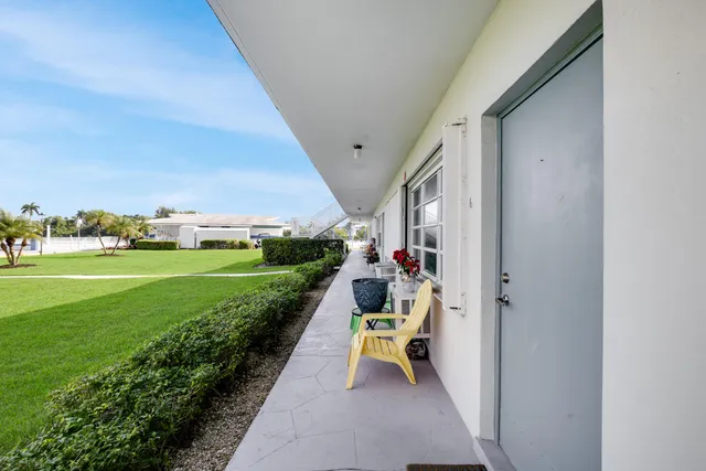 a view of an chairs and tables in the back yard