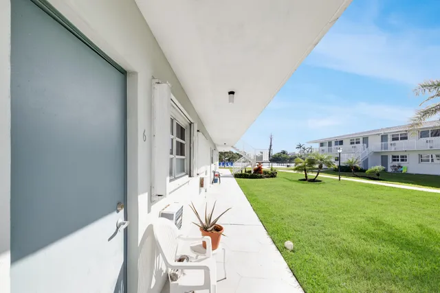 a view of lake with a table and chairs