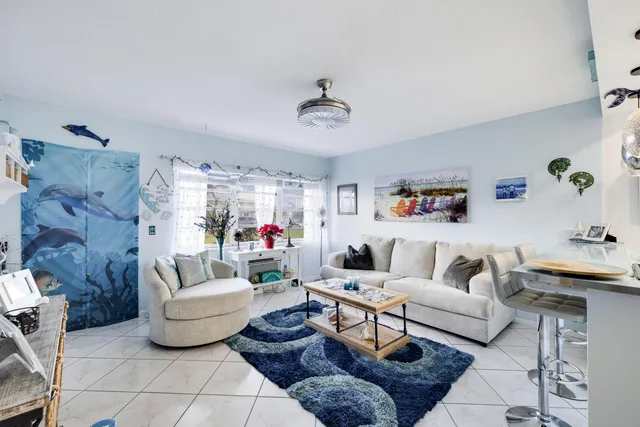 a living room with furniture and a rug