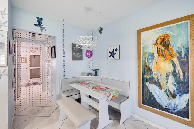 a kitchen with a sink dishwasher and a stove with white countertops