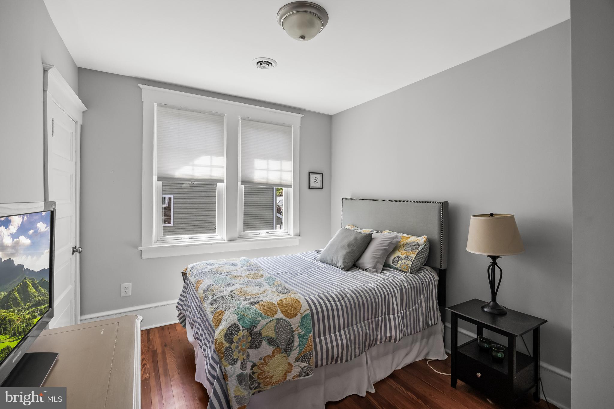 615 North Walnut Avenue Magnolia, NJ 08049 - Photo 22 of 40 a bedroom with a bed and large window
