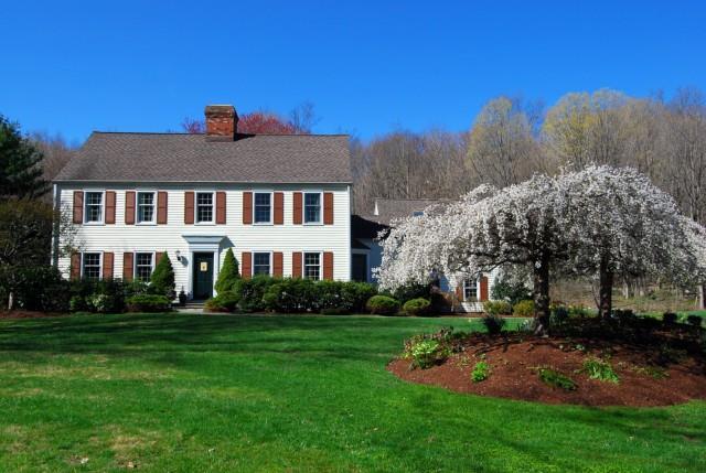100 Pheasant Run Road Wilton, CT 06897 - Photo 1 of 1 a front view of a house with a yard