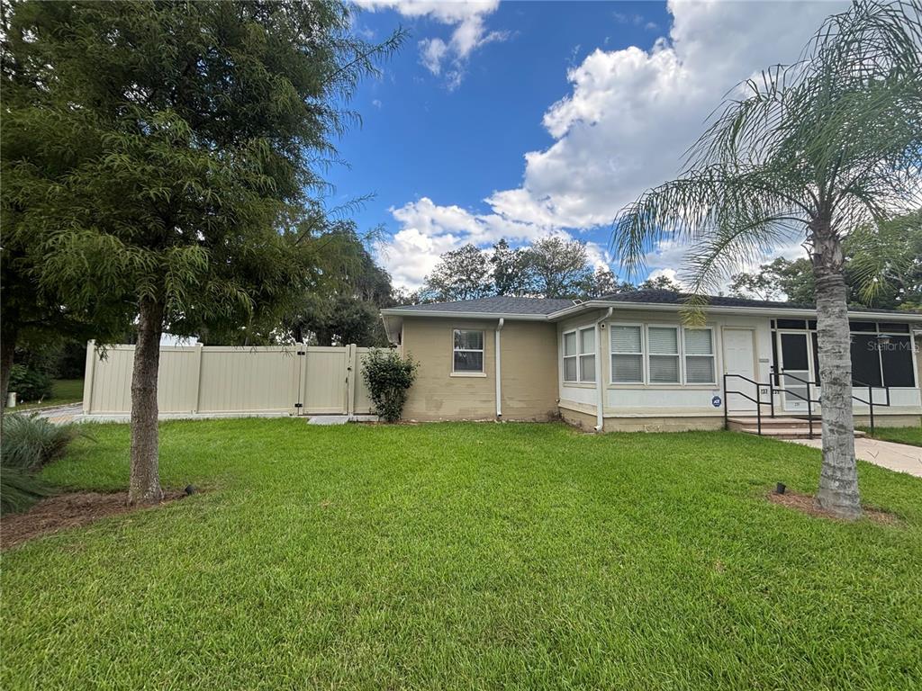 237 Northeast 11th Avenue Ocala, FL 34470 - Photo 17 of 17 a front view of a house with a garden