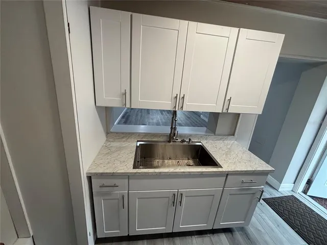 a kitchen with a sink and a window