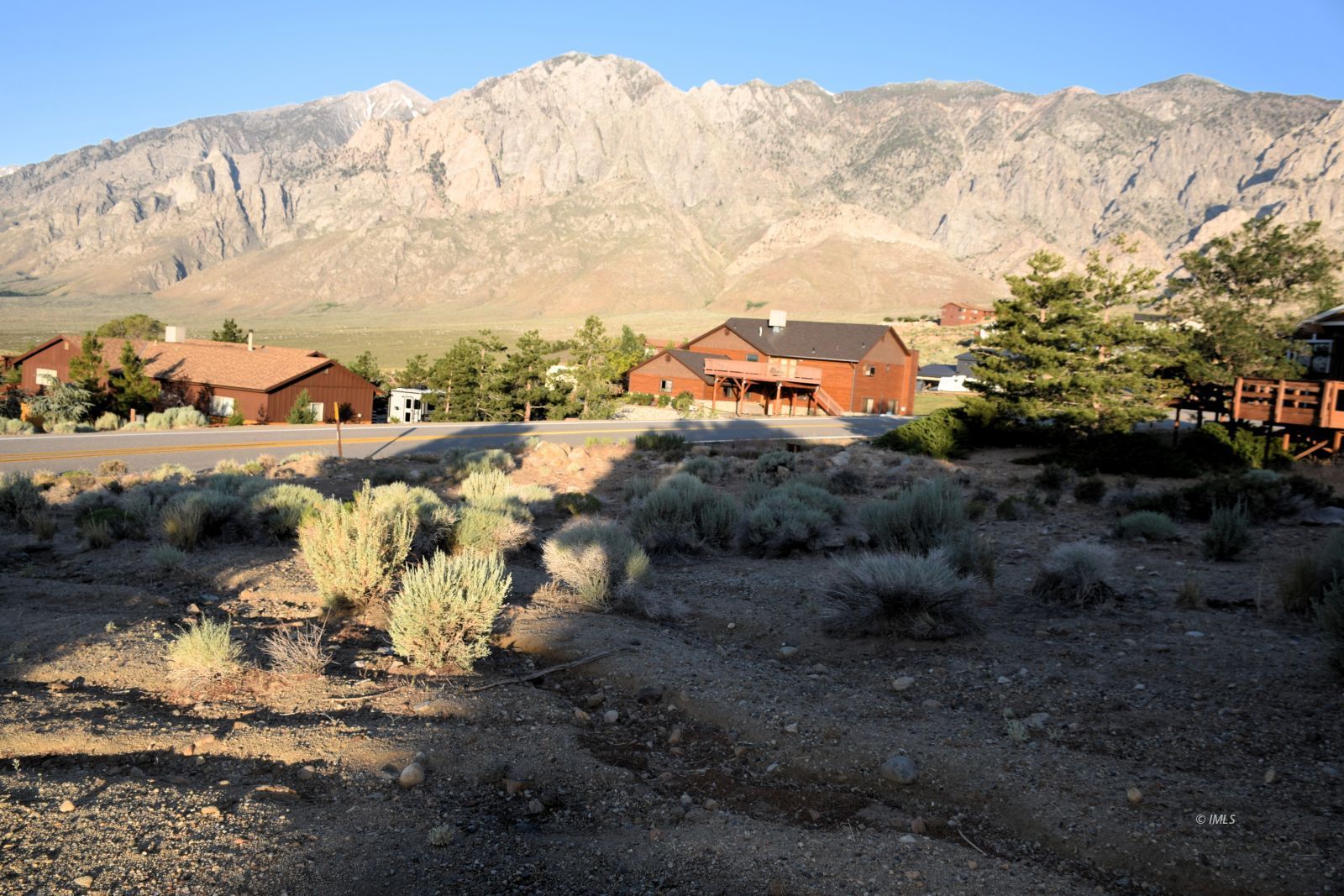 Paradise Point Bishop, CA 93514 - Photo 4 of 8 a view of a dry yard with mountains in the background