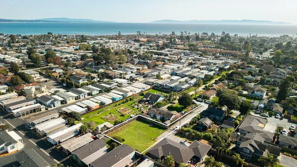 an aerial view of residential building with parking space