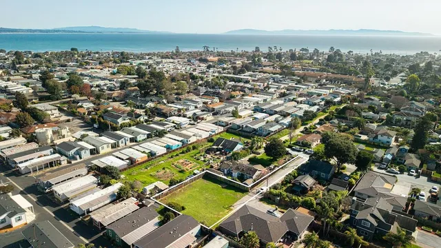 an aerial view of residential building with parking space