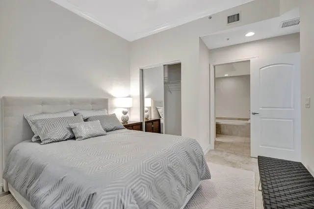 a bedroom with a bed and a walk in closet