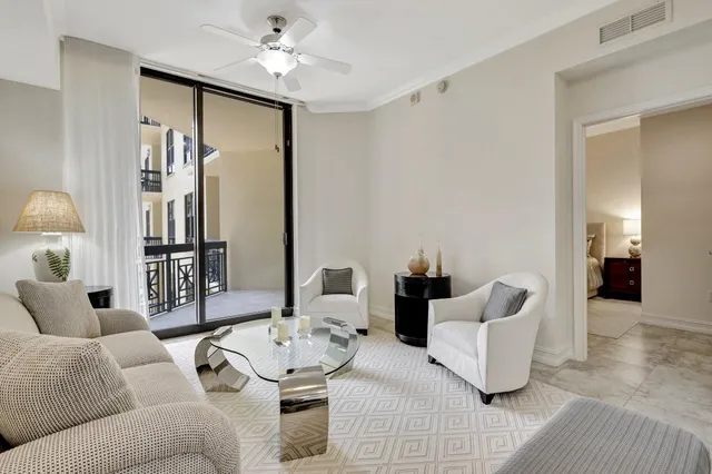 a living room with furniture and a lamp