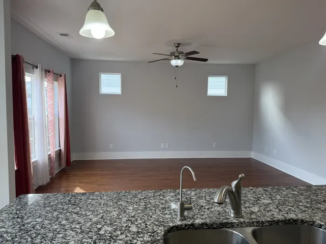a view of storage and utility room with racks on the wall