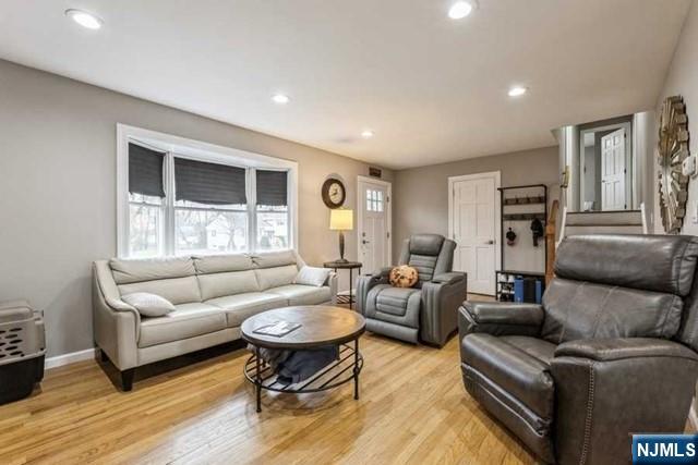 23 Asmus Road Closter, NJ 07624 - Photo 4 of 38 a living room with furniture and a large window
