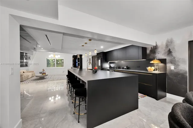 a kitchen with a sink appliances and cabinets