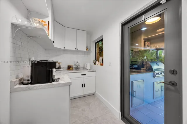 a kitchen with stainless steel appliances a stove a refrigerator and a sink