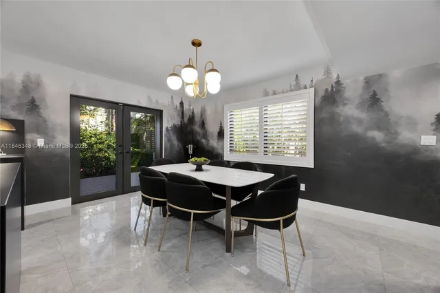 a dining room with a wooden table and chairs